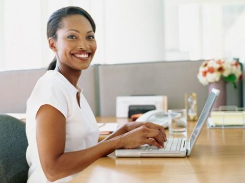 woman using laptop at desk
